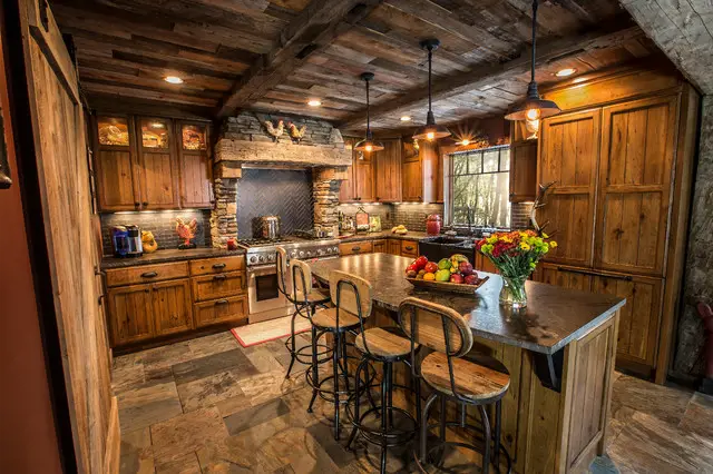 A rustic kitchen design featuring stone counter tops and wooden cabinets.