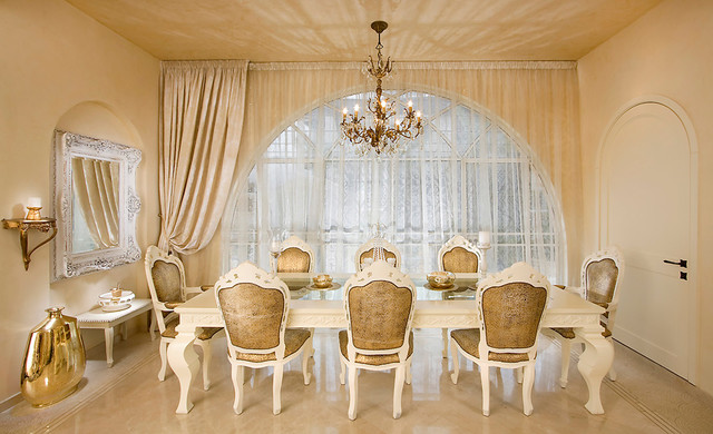 A Victorian dining room with a chandelier.