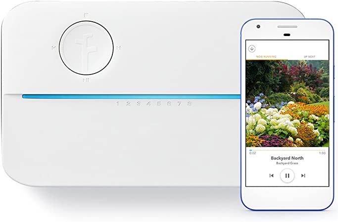 A smart home device for gardening with a smart phone next to it.