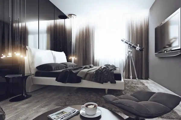 A black and white bachelor pad bedroom with a tv.