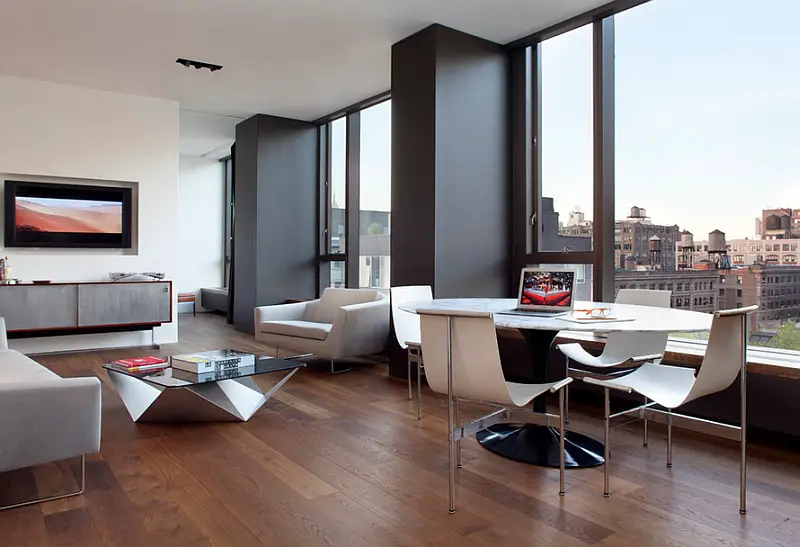 A minimalist living room with hardwood floors.