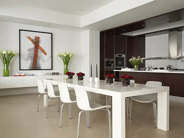 A minimalist dining table in a modern kitchen.