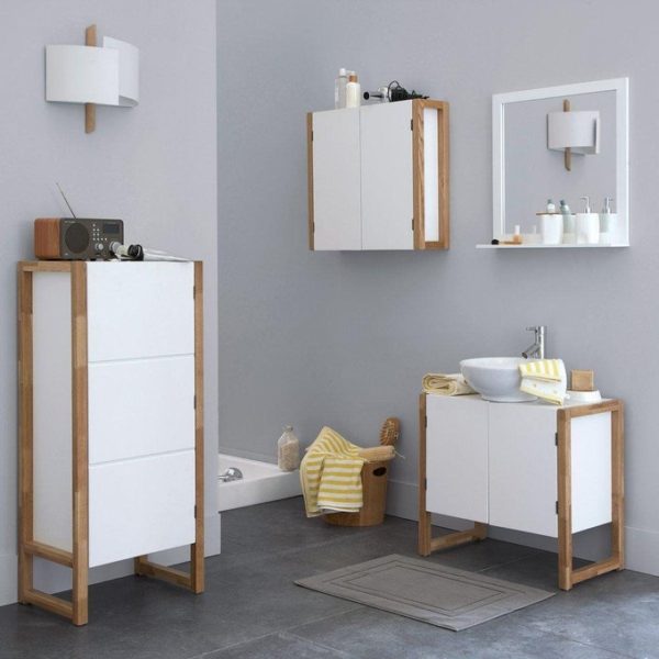 A white bathroom with wooden cabinets that provide ample storage space.