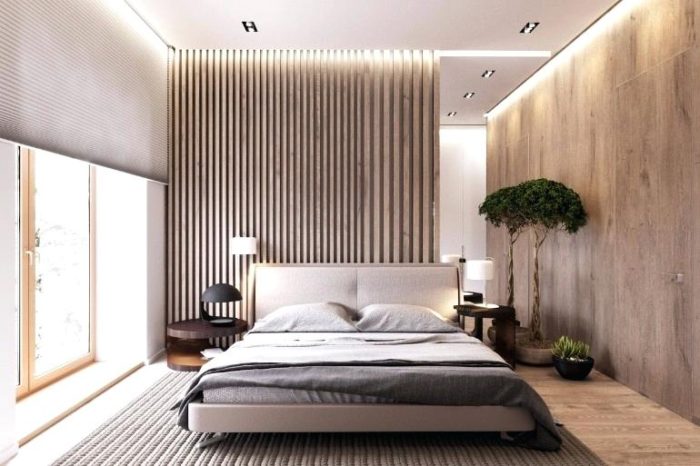 A small modern bedroom with wooden walls and a bed.