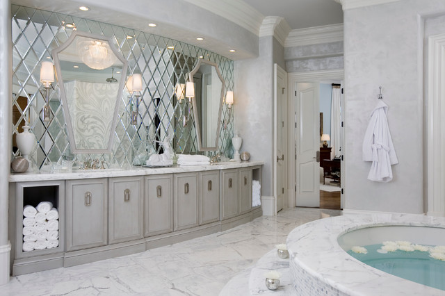 A bathroom with mirrors and jacuzzi tub.