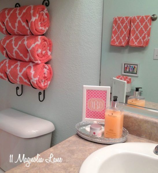 A bathroom with towels hanging on the wall providing storage space.