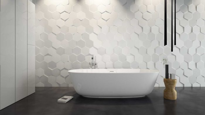 A modern bathroom with tiled walls.