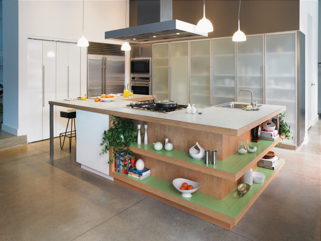 A green kitchen island in a modern kitchen.