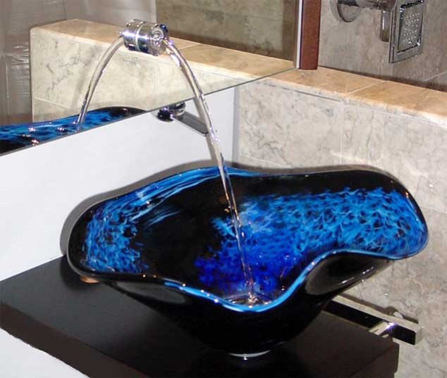 A modern bathroom sink featuring a blue glass bowl, offering unique design ideas.