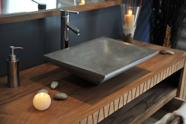 A bathroom with a concrete sink.