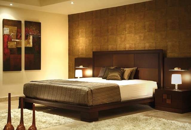 A contemporary bedroom with rich brown walls and a spacious bed.