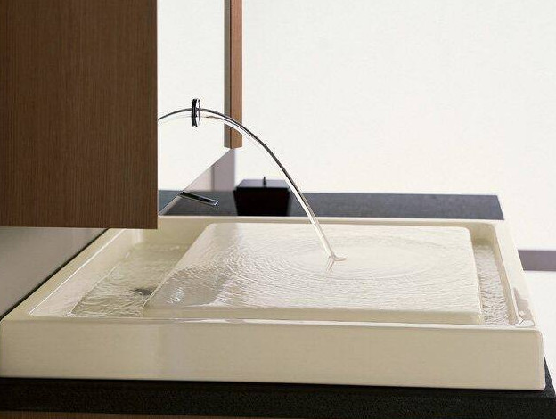A modern bathroom sink with innovative water fountain feature.