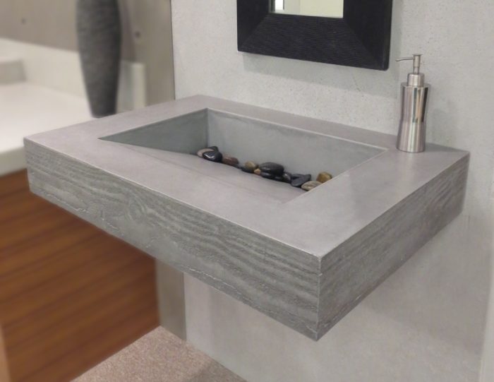 A concrete sink for modern bathroom ideas.