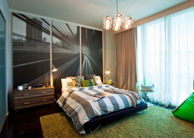 A bedroom with a large painting on the wall.