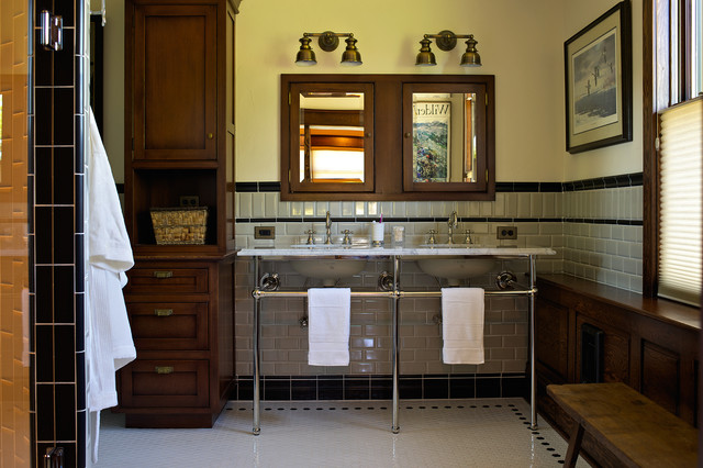 A bathroom with a sink, mirror, and towel rack, featuring stylish bathroom tile ideas.