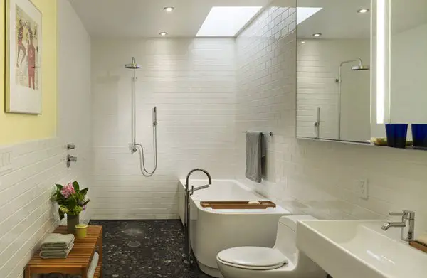 A small basement bathroom with a toilet, sink and shower.