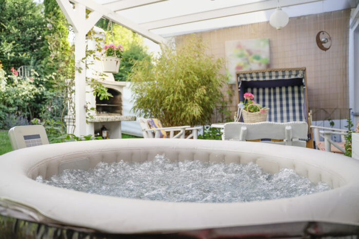A hot tub spa in a backyard.