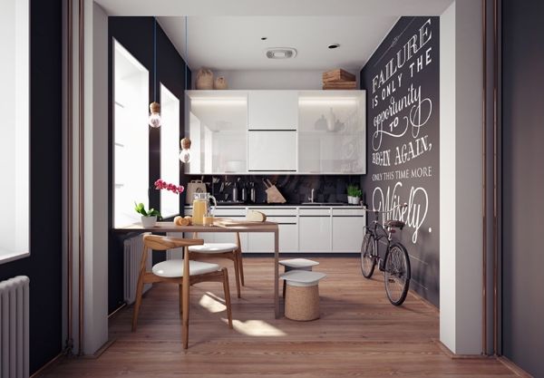 A monochromatic kitchen with a chalkboard wall.