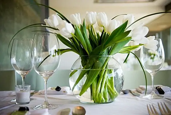 White tulips as a dining room table centerpiece.