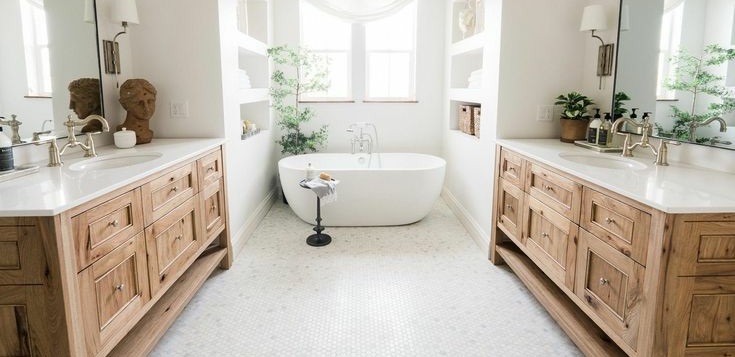 A white bathroom with wooden details and a tub.