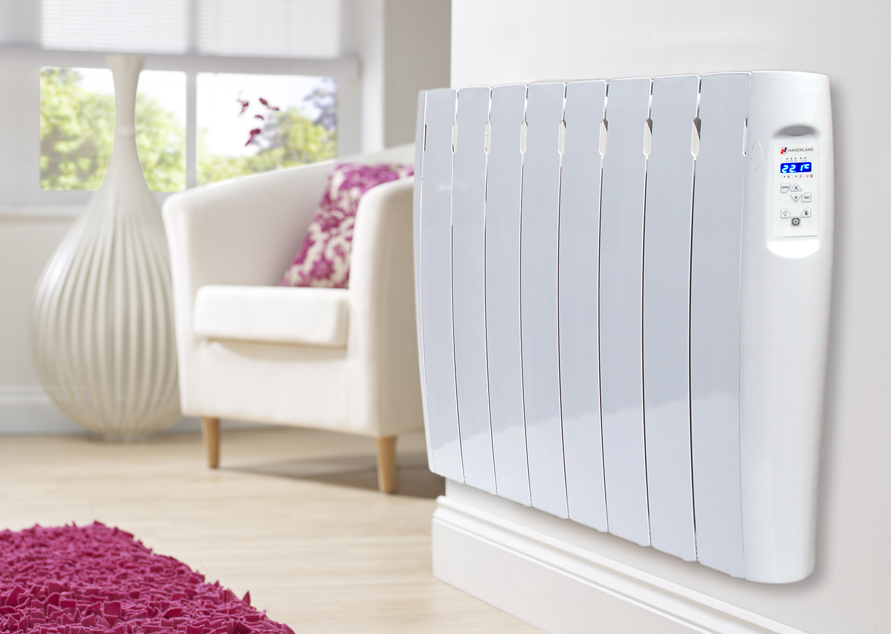 A white electric radiator in a living room.