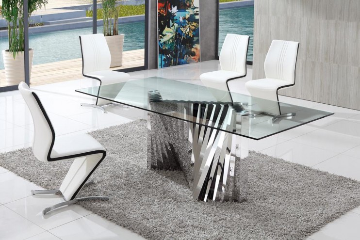 A modern glass dining table with white chairs from the selection of glass furniture.
