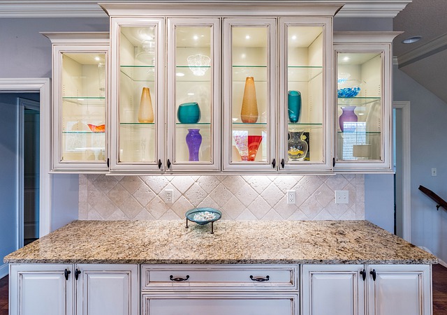 A white kitchen with glass cabinets and a granite counter top - Is it worth buying online?