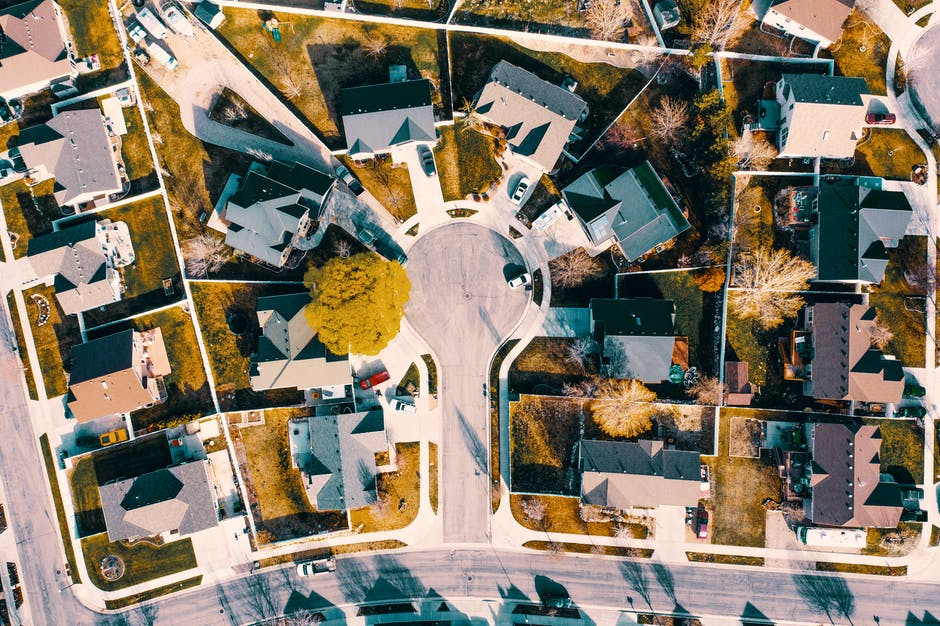 Aerial view of a residential neighborhood highlighting California's legal requirements for selling homes.