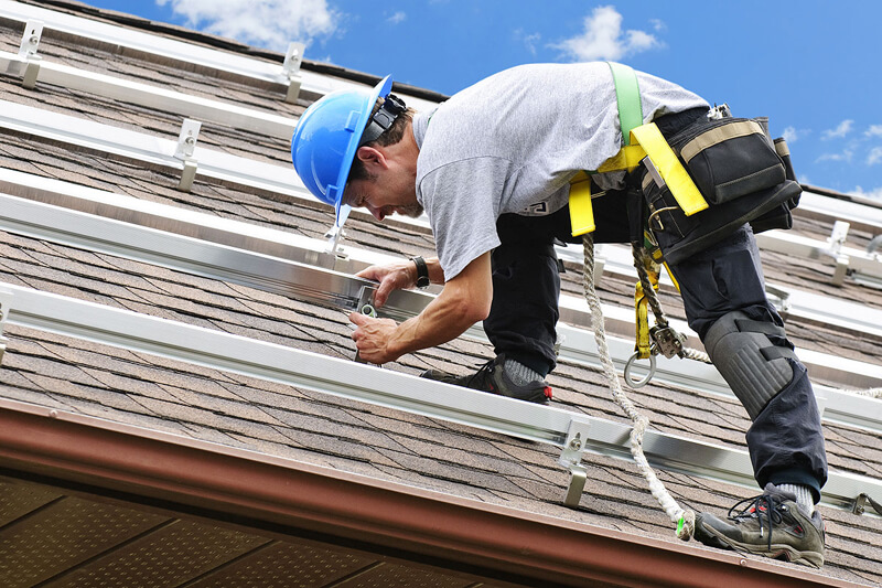 A roofer providing maintenance advice in West Palm Beach.