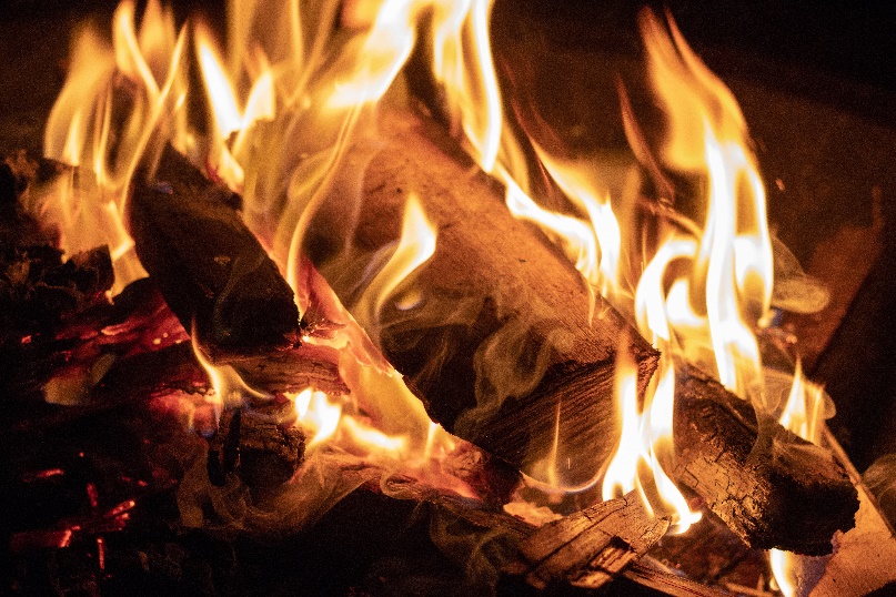 A close up of logs burning in a fire.