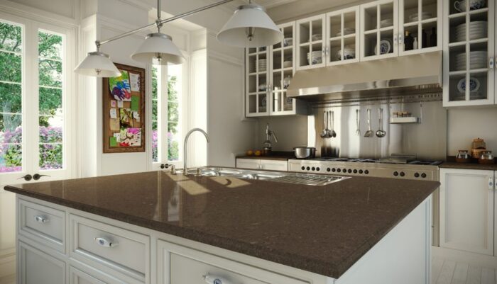 A kitchen with a stylish brown granite counter top.