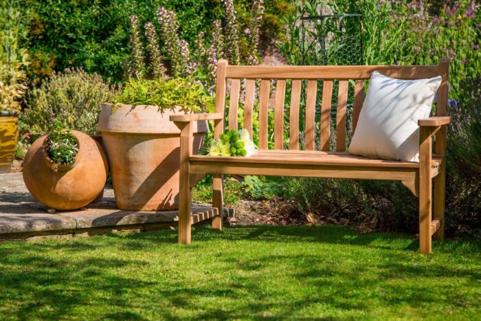 A wooden bench in an outdoor space.
