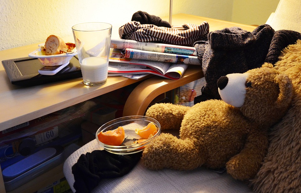 A teddy bear sitting on a chair, creating better storage.