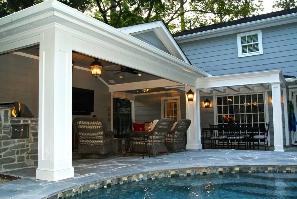 Renovation of a home with a pool and a covered patio.