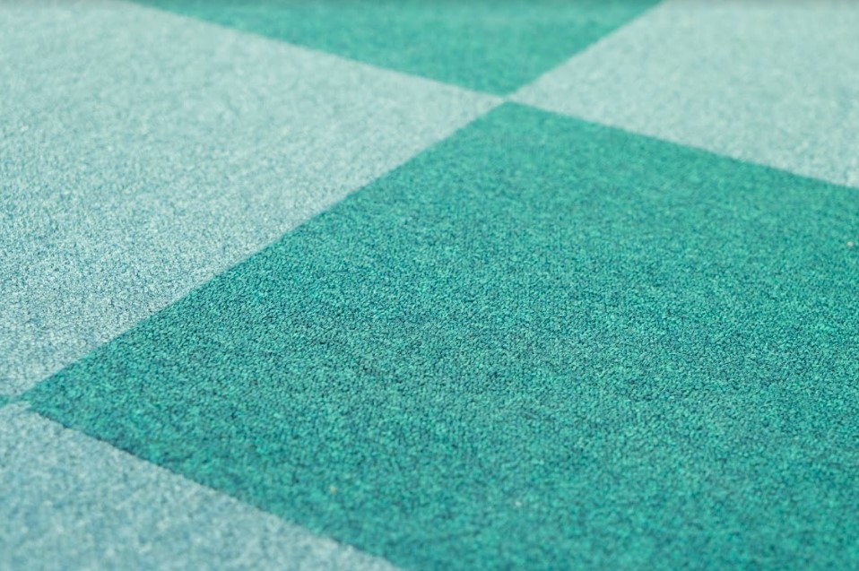 Exhibition Flooring in a close up of a green and blue checkered floor.