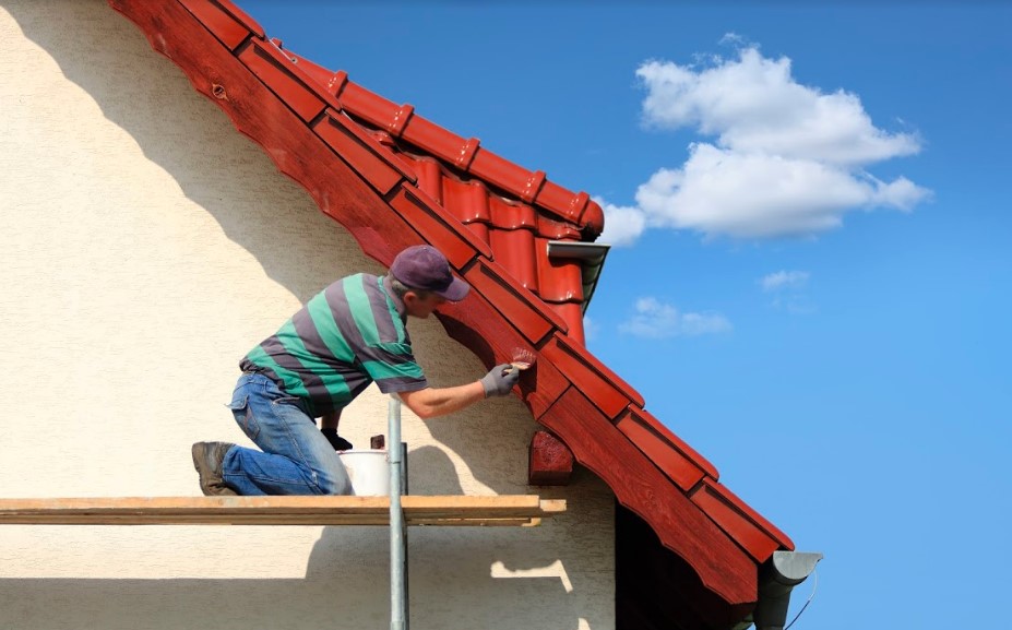 A man restoring an old roof.
