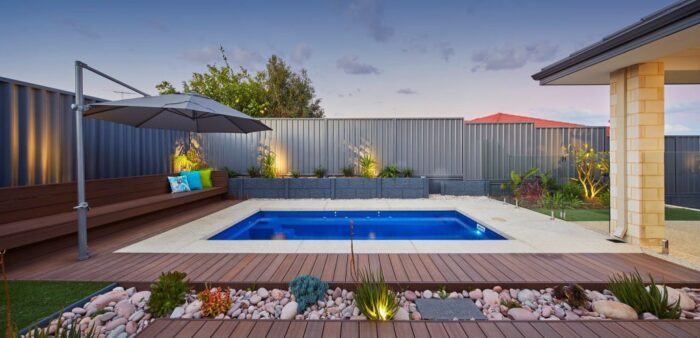 A backyard with a fibreglass pool.