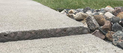 A close up of a concrete sidewalk.
