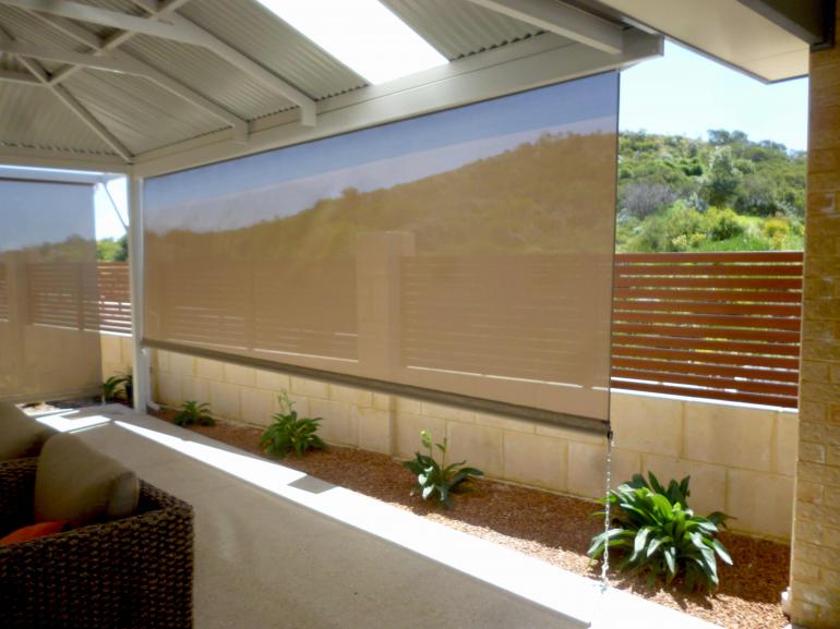 A patio with roller shade.