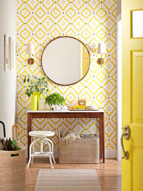 A hallway with fresh yellow wallpaper.