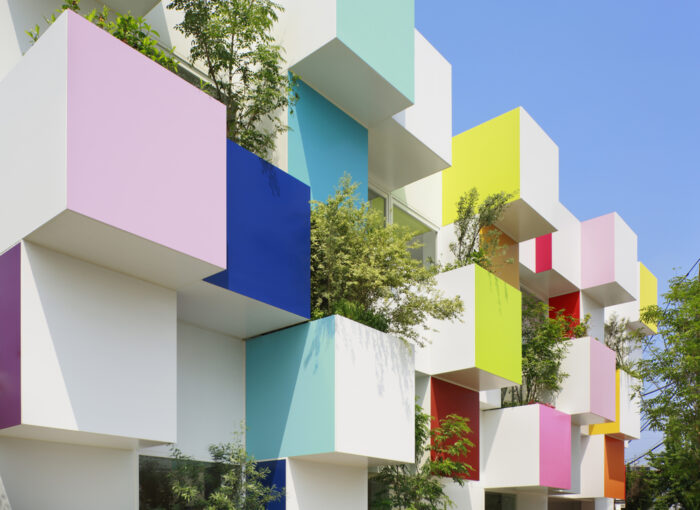 A building with colorful puzzle design cubes on it.
