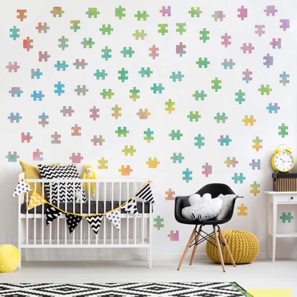 A vibrant nursery decorated with colorful jigsaw puzzle pieces.
