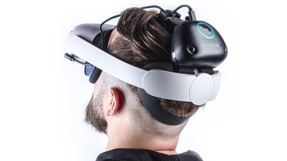 A man donning tech accessories, including a vr headset on his head.