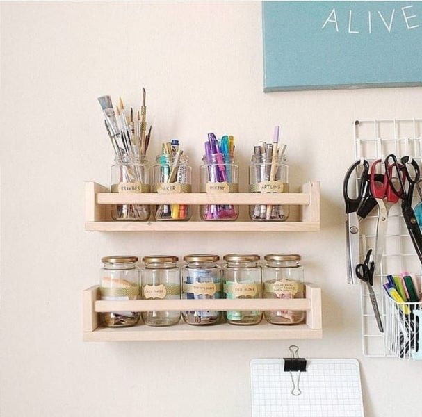 A home storage shelf with craft supplies.