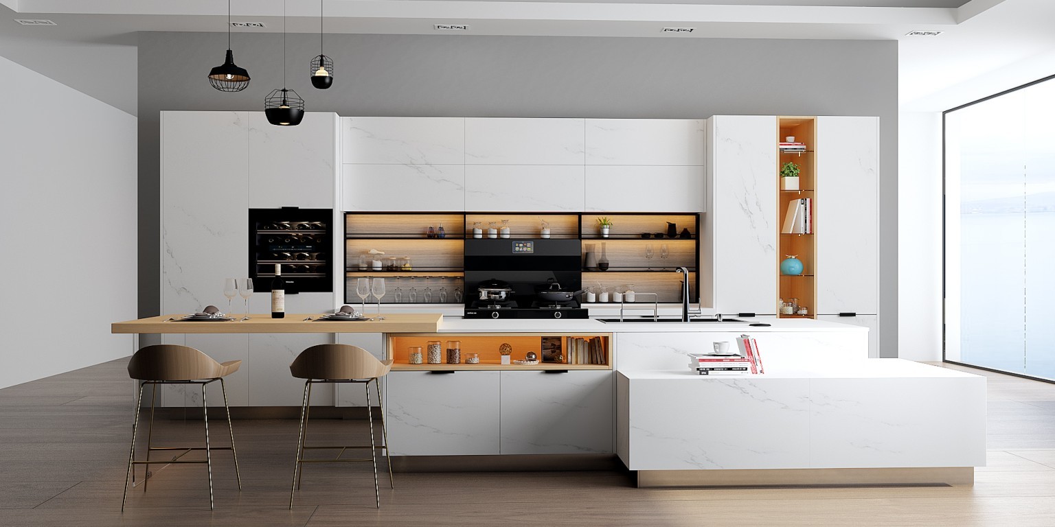 A modern kitchen design with white cabinets and marble counter tops.