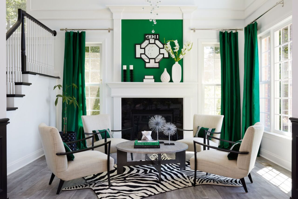 A living room with green curtains and zebra rugs filled with designer decor.