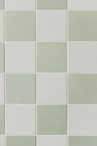 A close up of a waterproof tiled wall.