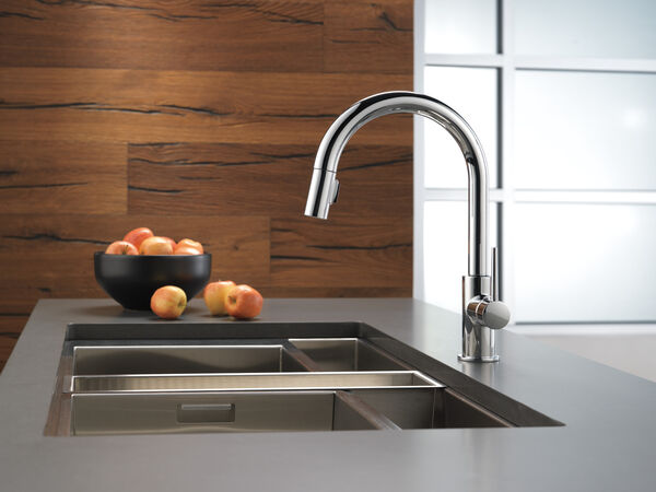 A contemporary kitchen with a stainless steel faucet.