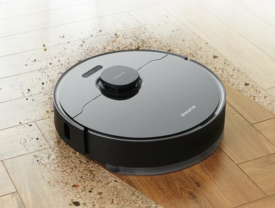 Samsung smart robot vacuum cleaner on a wooden floor.