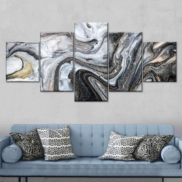 A sustainable black and white marble wall art on a couch.